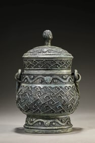 A BRONZE YOU WITH SWING HANDLE