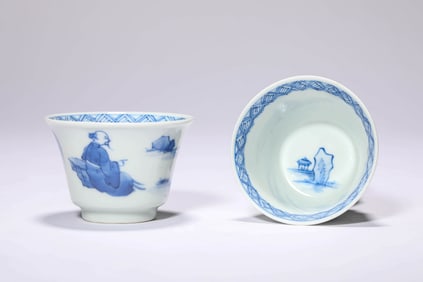 A PAIR OF BLUE AND WHITE 'FIGURE' CUPS
