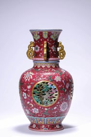 A RUBY RED GROUND FAMILLE-ROSE 'PINE-CRANE' REVOLVING VASE