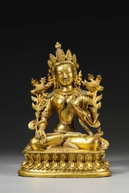 A GILT-BRONZE GREEN TARA