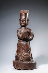 A WOODEN FIGURE