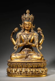 A GILT-BRONZE FOUR-ARMED AVALOKITESHVARA