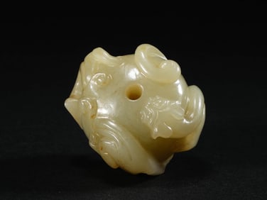 A JADE 'CHI DRAGON' BEAD