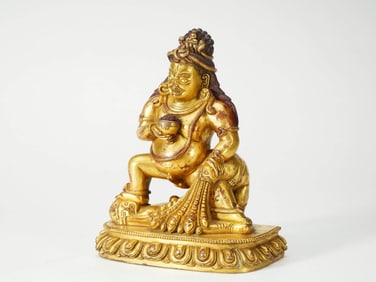 A GILT-BRONZE FIGURE OF THE GOD OF WEALTH