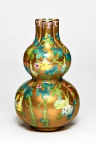 A GOLD-GROUND FAMILLE ROSE 'GOURD' GOURD-SHAPED VASE