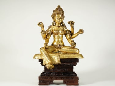 A GILT-BRONZE FIGURE OF FOUR-ARMED AVALOKITESHVARA