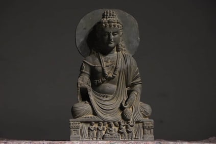 A GANDHARAN SEATED FIGURE
