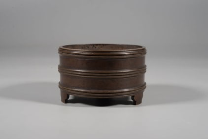 A BRONZE STRING-CENSER