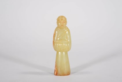 A YELLOW JADE 'FIGURE' ORNAMENT