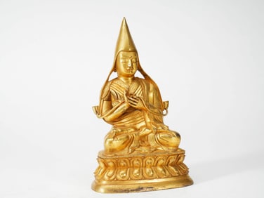 A GILT-BRONZE FIGURE OF TSONGKHAPA