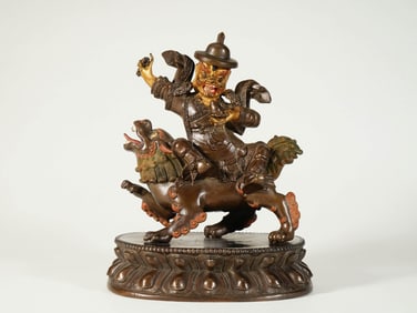 A GILT-BRONZE FIGURE OF THE PROTECTOR MAHAKALA