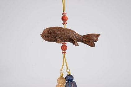 AN ALOESWOOD 'FISH' PENDANT