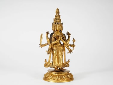 A GILT-BRONZE FIGURE OF SIX-ARMED AVALOKITESHVARA