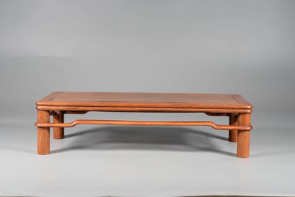 A HUANGHUALI ROUND-TOP NESTED TABLE