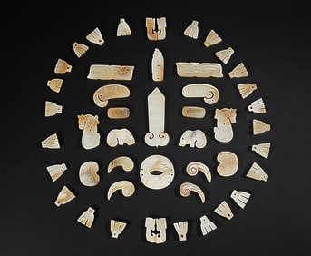 A SET OF JADE 'FACE-COVER' PLAQUES