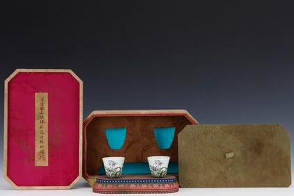 A PAIR OF ENAMEL BELL-SHAPED CUPS
