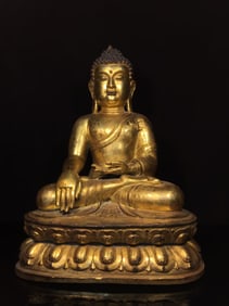 A GILT-BRONZE FIGURE OF SAKYAMUNI BUDDHA