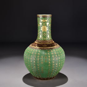 A GREEN-GROUND CARVED 'THOUSAND CHARACTER CLASSIC' GLOBULAR VASE