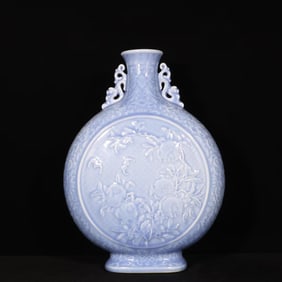 A SKY-BLUE GLAZED CARVED 'BAT, SHOU CHARACTER AND POMEGRANATE' MOONFLASK