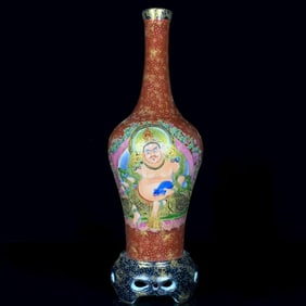 AN ENAMEL 'FIGURES' REVOLVING VASE