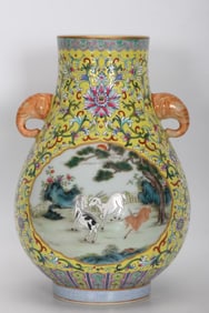 A YELLOW-GROUND FAMILLE ROSE MEDALLION 'THREE GOATS' TWO-HANDLED VASE