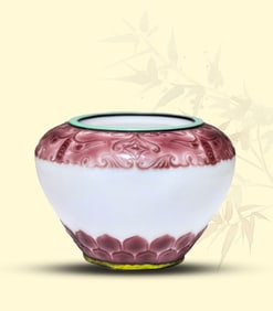 A PURPLE-OVER-WHITE GLASS 'ANIMAL-MASK' BOWL
