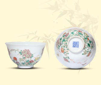 A PAIR OF FAMILLE-ROSE 'BUTTERFLY-AND-FLOWER' BOWLS