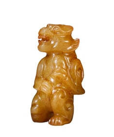 A JADE CARVING OF AUSPICIOUS BEAST