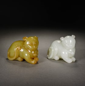 A GROUP OF WHITE AND YELLOW JADE TIGERS