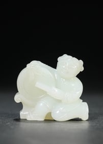 A JADE CARVING OF FIGURE
