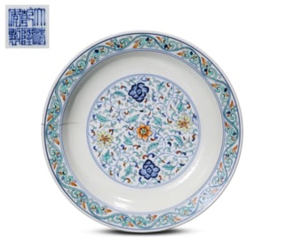 A DOUCAI 'HUNDRED FLOWERS AND INTERLOCKING PATTERN' DISH