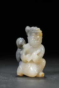 A BLACK AND WHITE JADE FIGURE