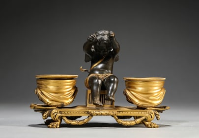 A BRONZE ANGEL FIGURE