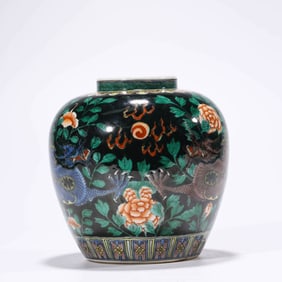 A BLACK-GLAZED WUCAI 'DRAGON PLAYING WITH PEARL' JAR