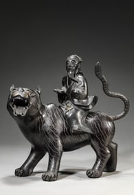 A BRONZE FIGURE