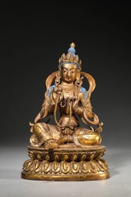 A GILT-BRONZE FIGURE OF BUDDHA