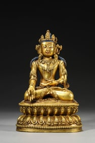 A GILT-BRONZE FIGURE OF BUDDHA