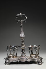 A SILVER CANDLESTICK