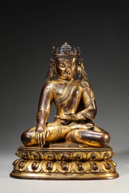 A GILT-BRONZE FIGURE OF SHAKYAMUNI