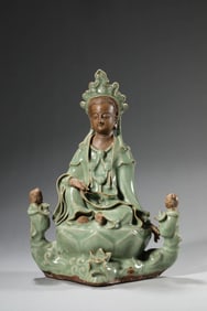 A LONGQUAN CELADON FIGURE OF CHILD-GIVING GUANYIN