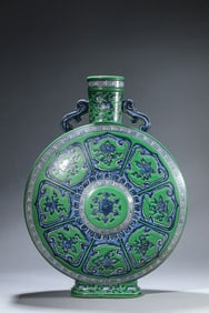 A GREEN-GROUND BLUE AND WHITE 'EIGHT TREASURES' MOONFLASK