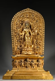 A GILT-BRONZE EIGHT-ARMED AVALOKITESHVARA