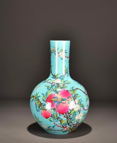 A GREEN-GROUND FAMILLE ROSE 'FLORAL ABUNDANCE' GLOBULAR VASE