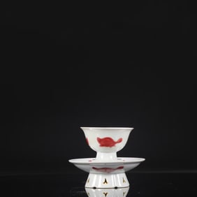 A SET OF COPPER-RED 'FISH' CUP STANDS