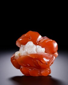 A SOUTHERN RED AGATE 'DRUNKEN LI BAI' CARVING