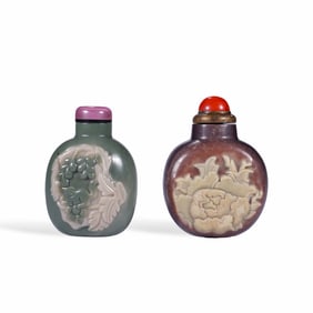 A LIVER-AGATE SNUFF BOTTLE AND A PURPLE-JADE SNUFF BOTTLE