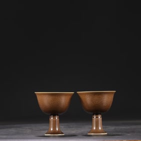 A PAIR OF PURPLE-GOLD GLAZED CARVED 'CLOUD AND DRAGON' STEM CUPS