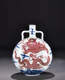 A BLUE AND WHITE WITH COPPER-RED 'DRAGON IN WAVES' MOONFLASK