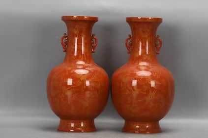 A PAIR OF RED-GROUND GILT-DECORATED 'CRANE' TWO-HANDLED VASES