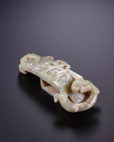 A 'DRAGON' SWORD ORNAMENT
